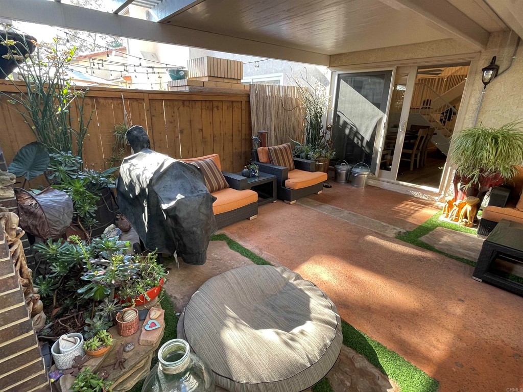 6972 Batiquitos Drive Carlsbad, CA 92011 - Photo 30 of 36 a view of a backyard with furniture and a grill