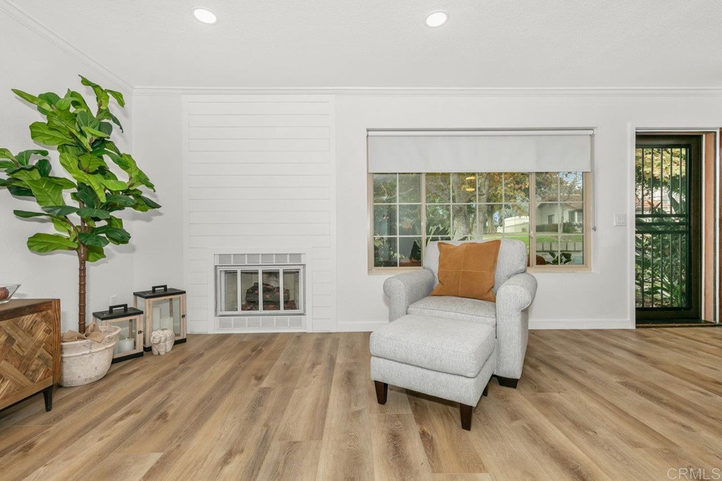 6972 Batiquitos Drive Carlsbad, CA 92011 - Photo 31 of 36 a living room with furniture and a potted plant