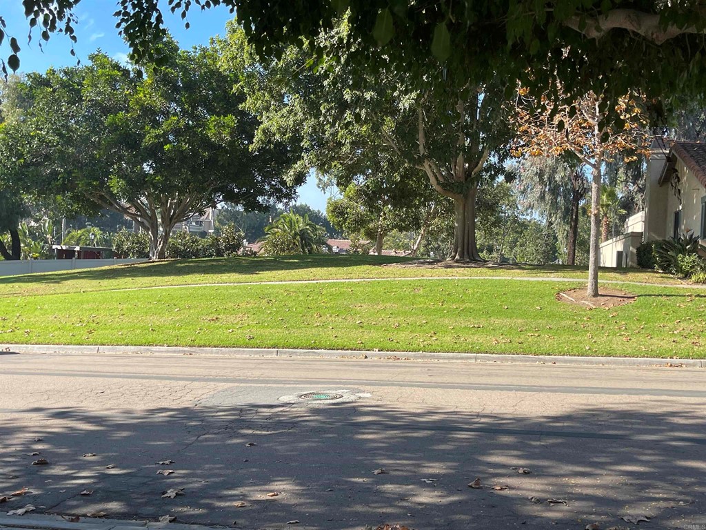 6972 Batiquitos Drive Carlsbad, CA 92011 - Photo 34 of 36 a view of a swimming pool and a yard