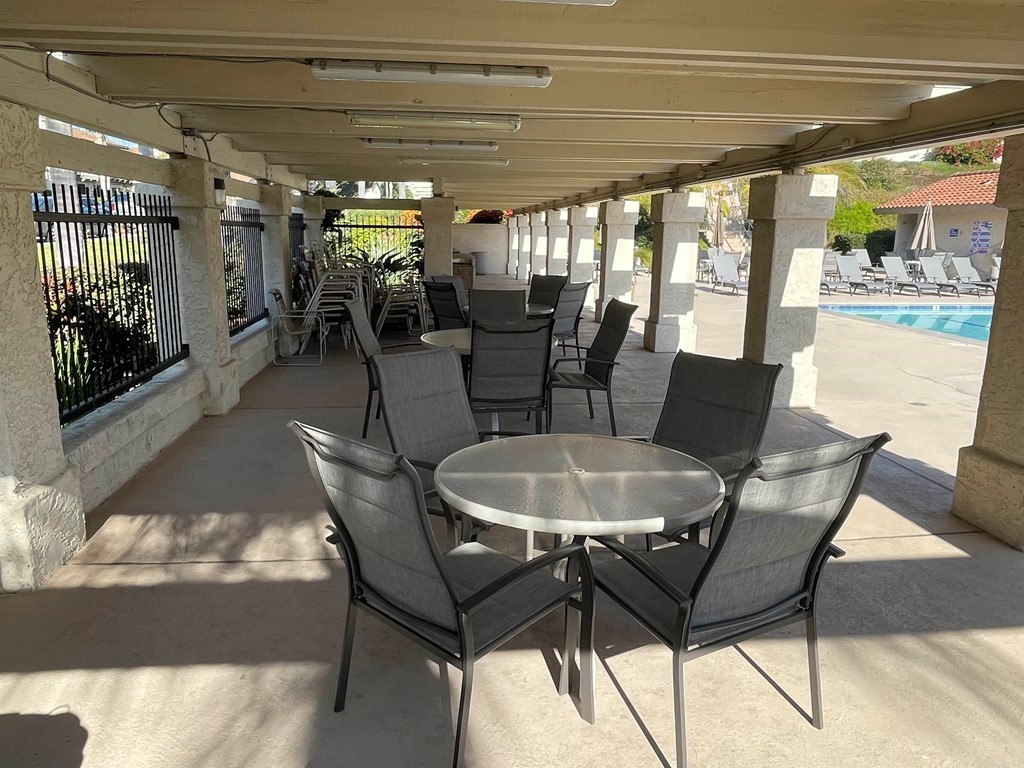 6972 Batiquitos Drive Carlsbad, CA 92011 - Photo 36 of 36 a dining room with furniture and a floor to ceiling window