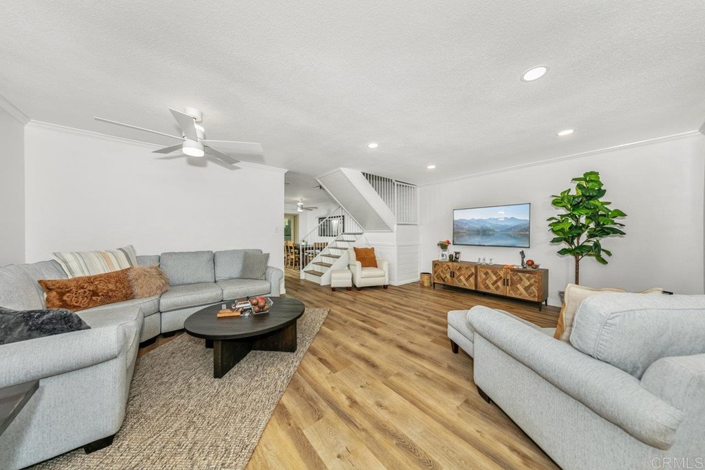 6972 Batiquitos Drive Carlsbad, CA 92011 - Photo 4 of 36 a living room with furniture and a chandelier