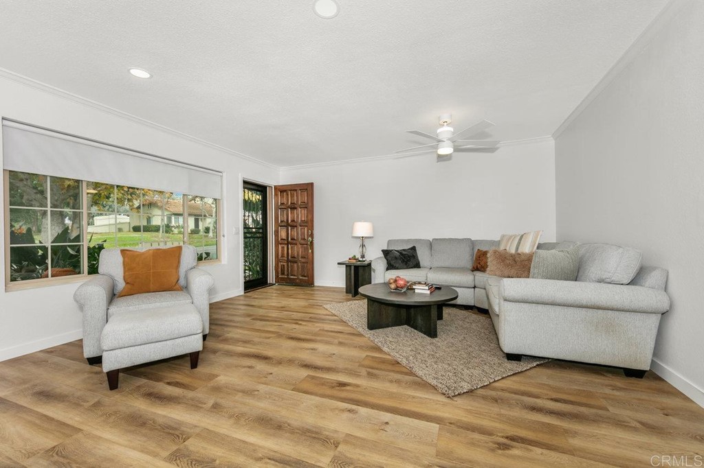 6972 Batiquitos Drive Carlsbad, CA 92011 - Photo 5 of 36 a living room with furniture and a large window