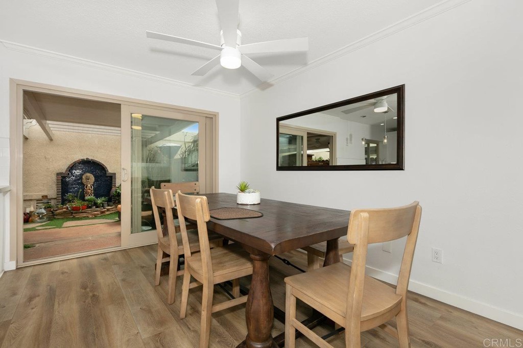 6972 Batiquitos Drive Carlsbad, CA 92011 - Photo 6 of 36 a view of a dining room with furniture and wooden floor