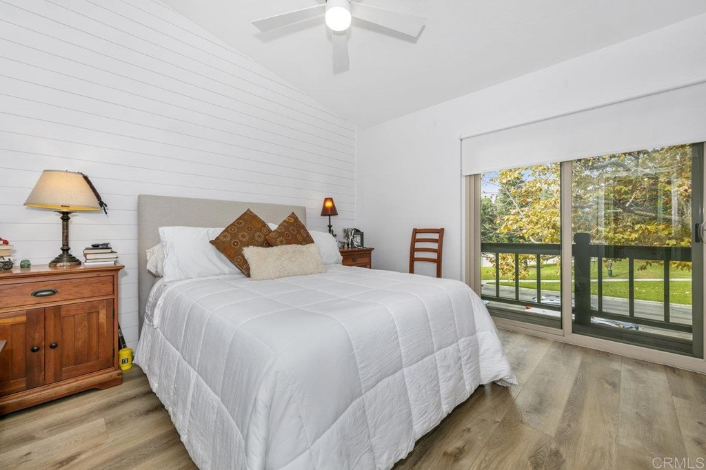 6972 Batiquitos Drive Carlsbad, CA 92011 - Photo 7 of 36 a bedroom with a large bed and a large window