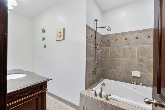 a bathroom with a bathtub and a shower