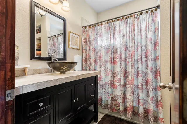 a bathroom with a double vanity sink and a mirror