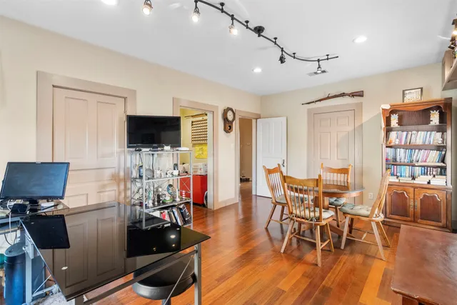 a view of a dining room with furniture window and wooden floor