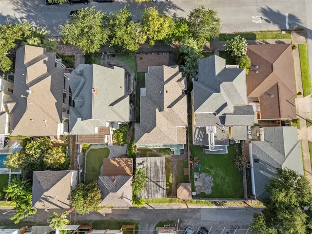 an aerial view of houses with outdoor space