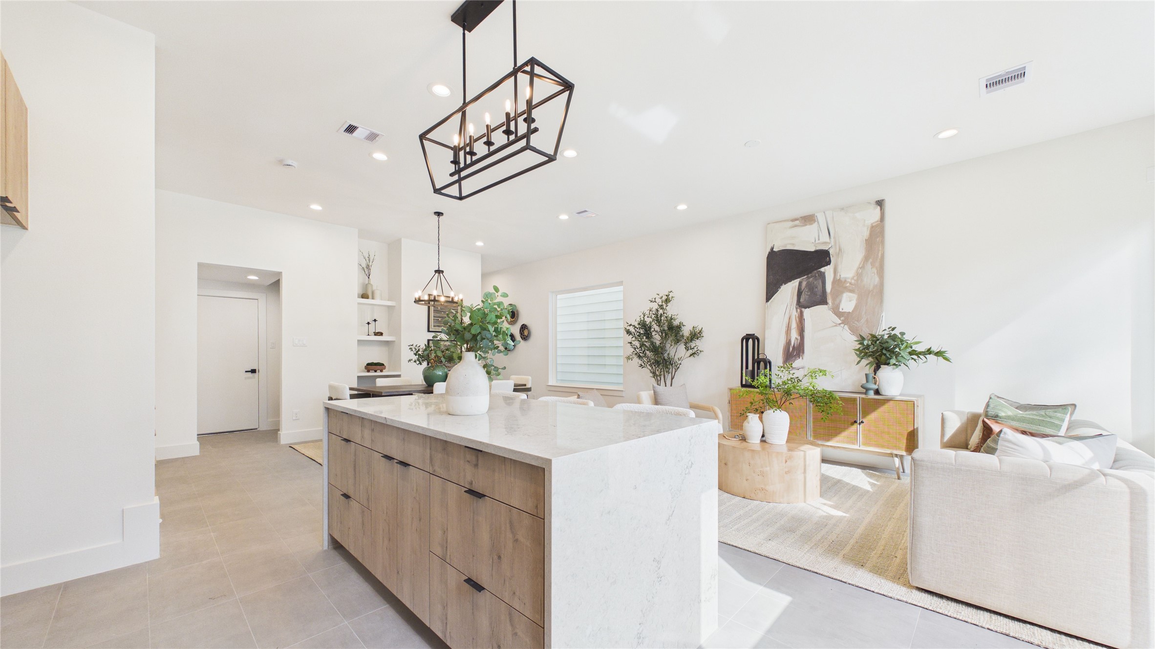 6058 Cebra Street Houston, TX 77091 - Photo 12 of 38 Oversized windows and recessed lighting truly brighten this home throughout! The soft glow allows for a warm environment that you can enjoy.