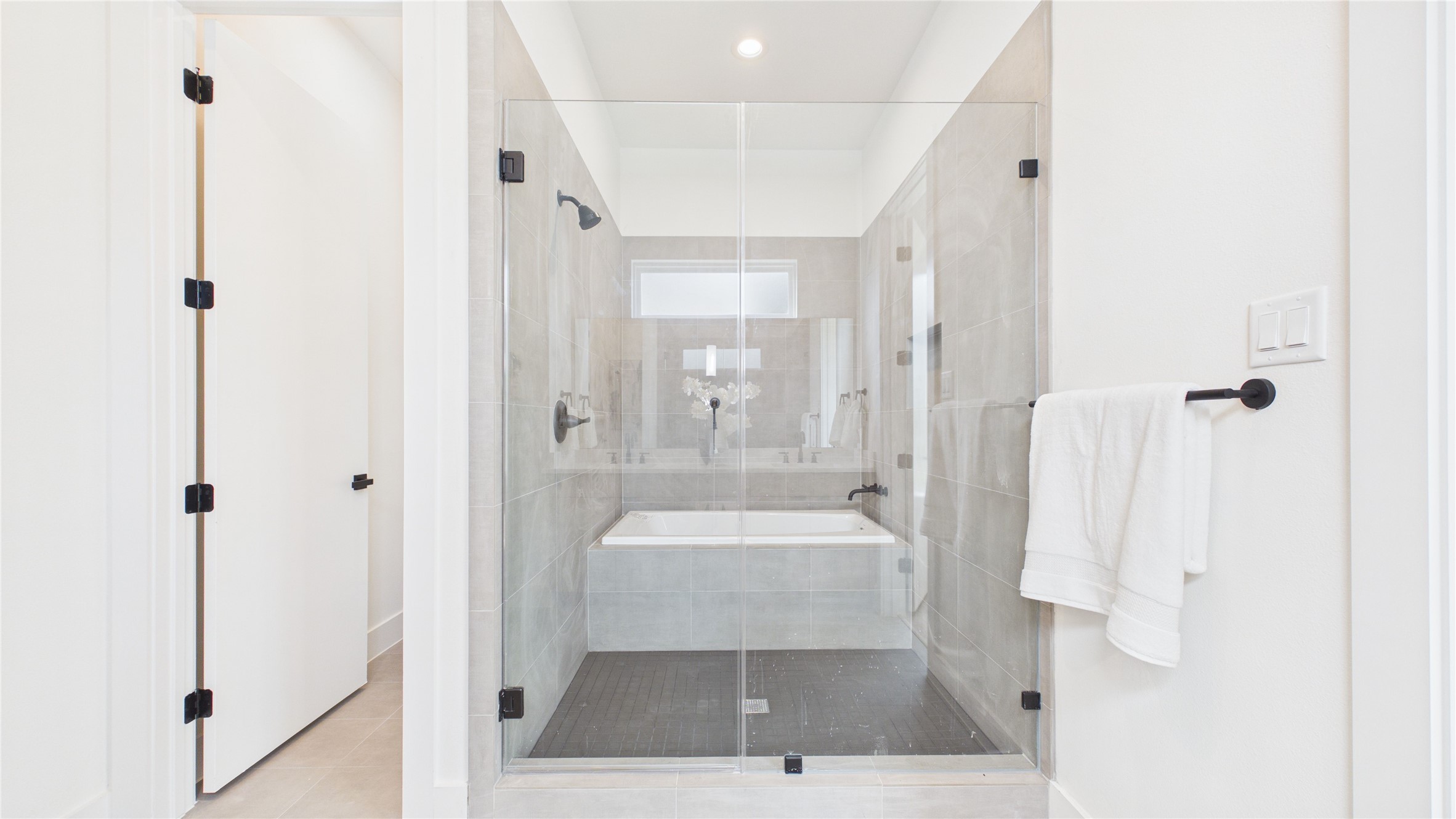 6058 Cebra Street Houston, TX 77091 - Photo 28 of 38 The primary bathroom is truly spa-like with this enclosed bathing oasis!