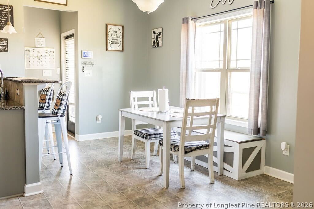 210 McGougan Road Lumber Bridge, NC 28357 - Photo 17 of 47 a view of a dining room with furniture