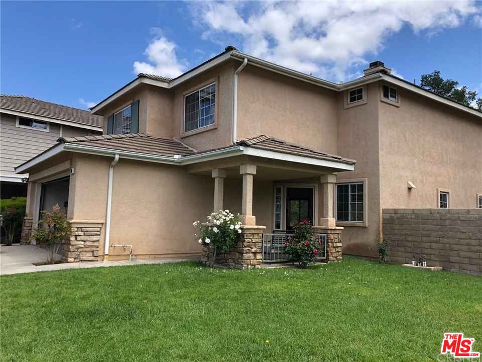 1706 Empty Saddle Road Simi Valley, CA 93063 - Photo 1 of 2 a front view of a house with a yard