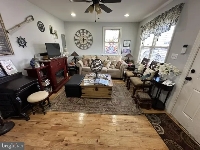 a living room with lots of furniture and a flat screen tv