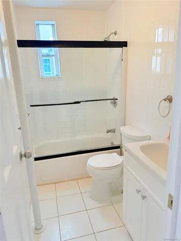 a white toilet sitting next to a bathroom sink