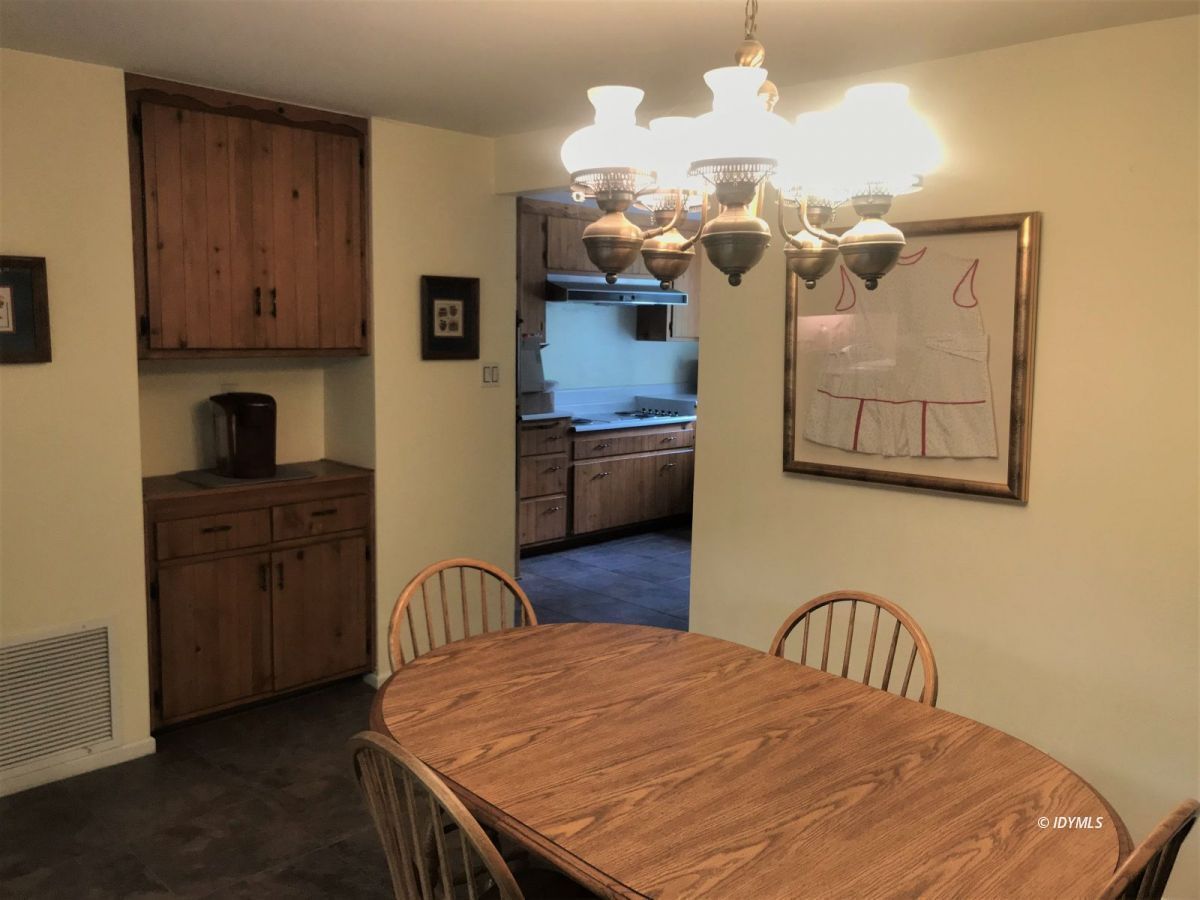 55441 Howland Road Idyllwild, CA 92549 - Photo 14 of 40 a bedroom with a bed dresser and wooden floor