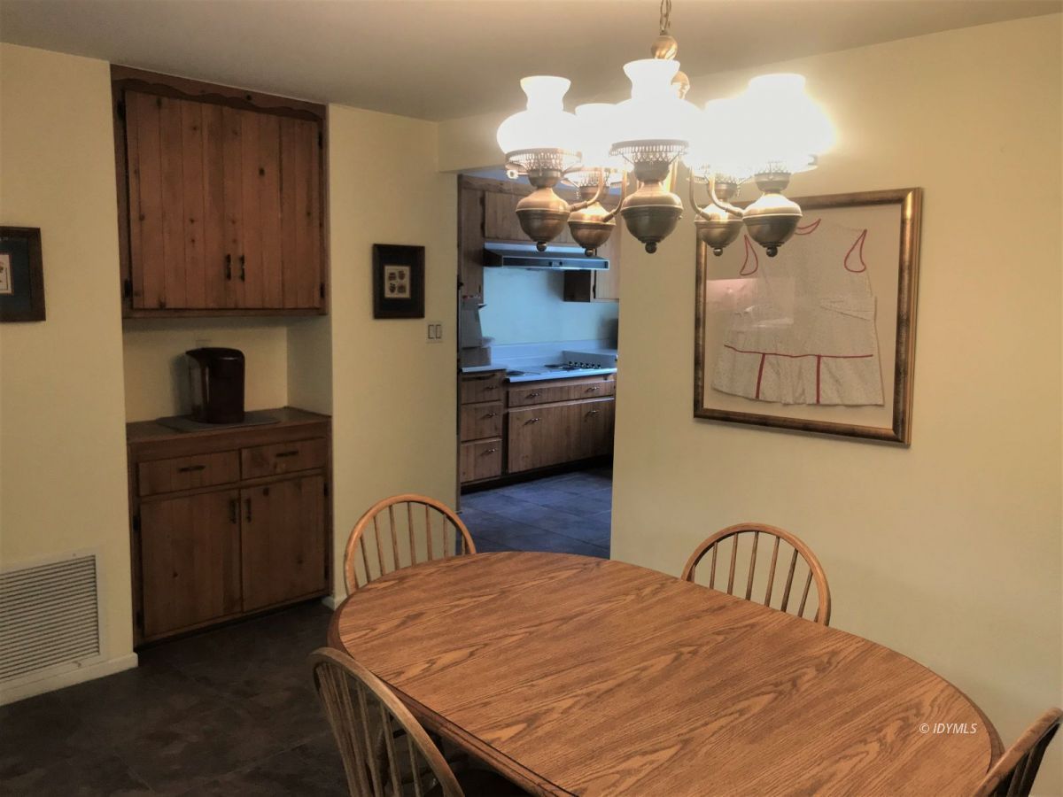 55441 Howland Road Idyllwild, CA 92549 - Photo 15 of 40 a bedroom with a bed dresser and wooden floor