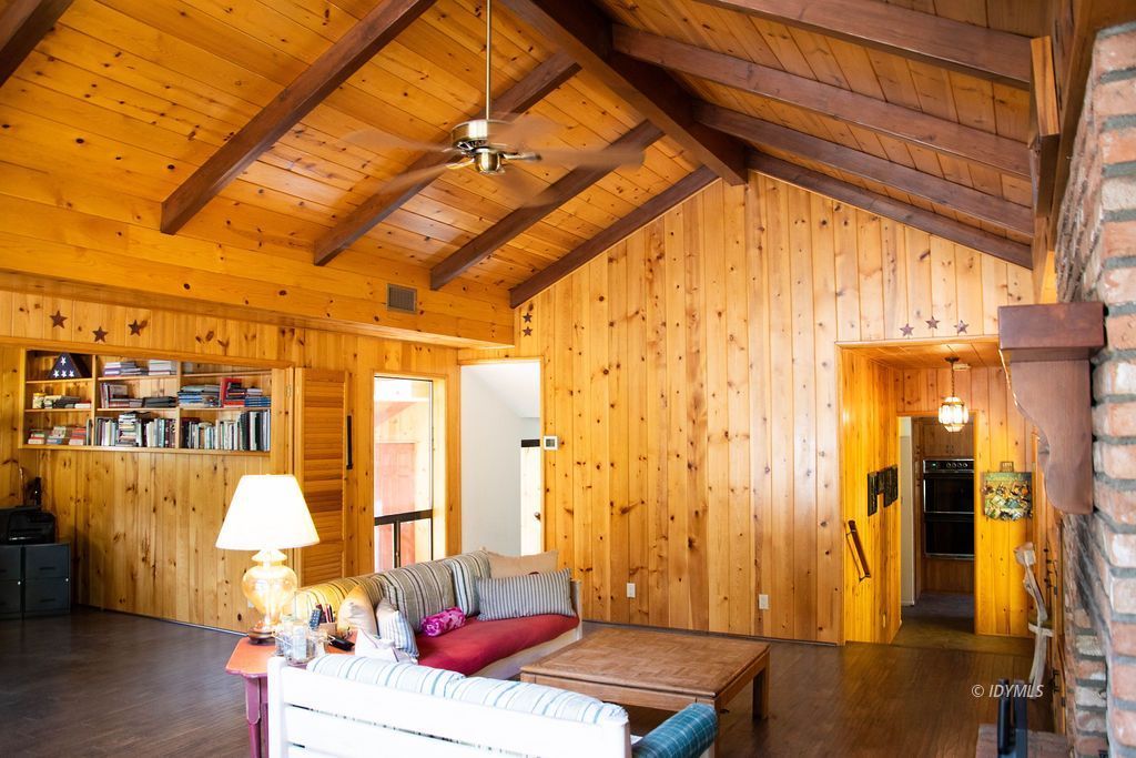 55441 Howland Road Idyllwild, CA 92549 - Photo 4 of 40 a living room with furniture and a chandelier