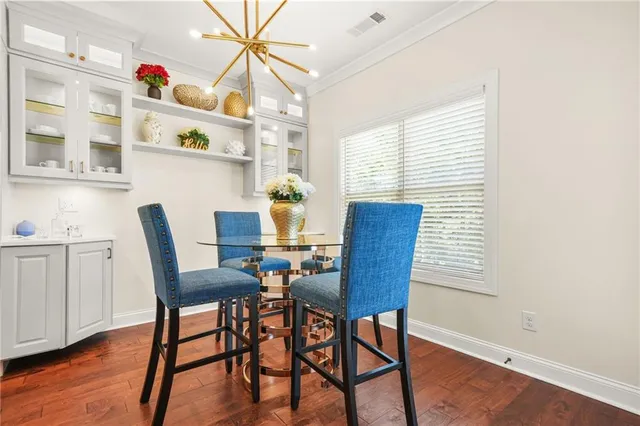 a view of an empty room and wooden floor