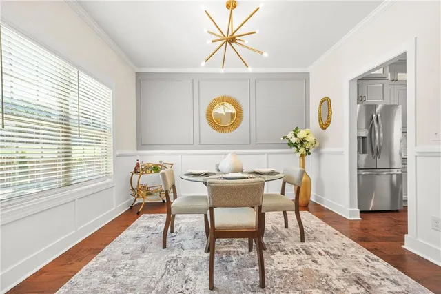 a living room with fireplace furniture and a wooden floor