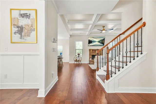 a view of an entryway with wooden floor