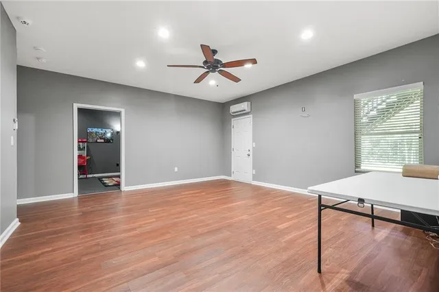 an aerial view of a house with a yard basket ball court and outdoor seating