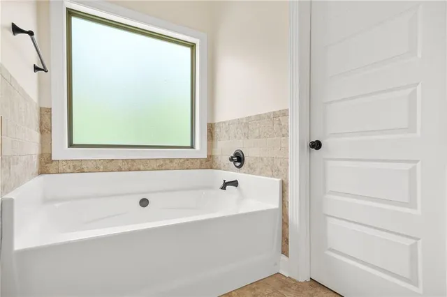 a large white bed in a white room