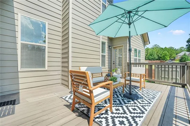 an aerial view of a house with a yard and lake view