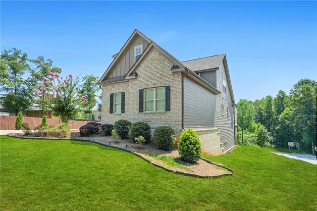 a view of a dining room with furniture and a chandelier