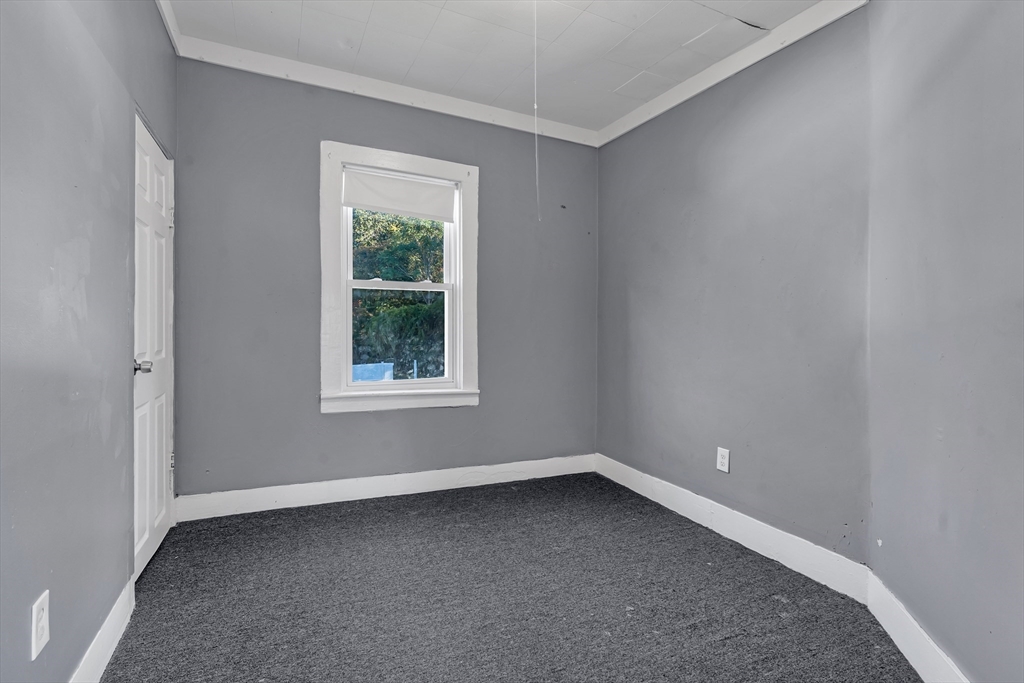 13 R Plain Street, Unit 2 Taunton, MA 02780 - Photo 11 of 21 an empty room with a window