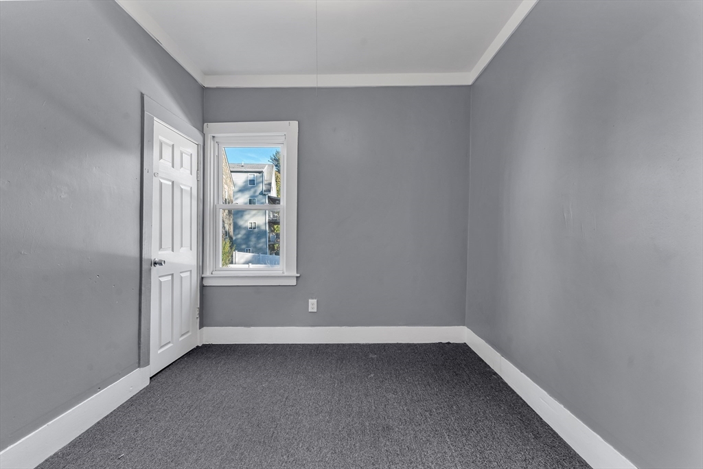 13 R Plain Street, Unit 2 Taunton, MA 02780 - Photo 15 of 21 a view of an empty room with a window