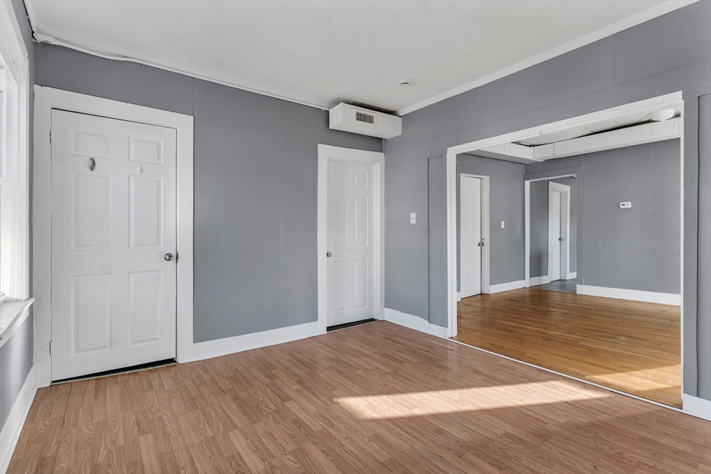 13 R Plain Street, Unit 2 Taunton, MA 02780 - Photo 5 of 21 a view of an empty room and wooden floor