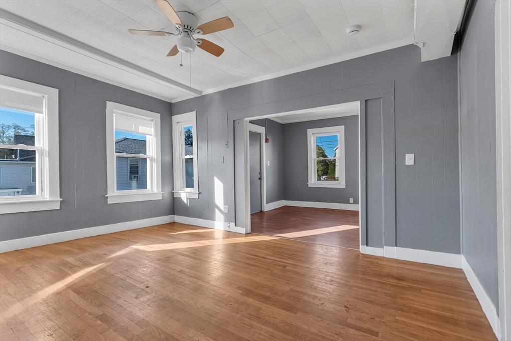 13 R Plain Street, Unit 2 Taunton, MA 02780 - Photo 6 of 21 a view of livingroom with hardwood floor and hallway