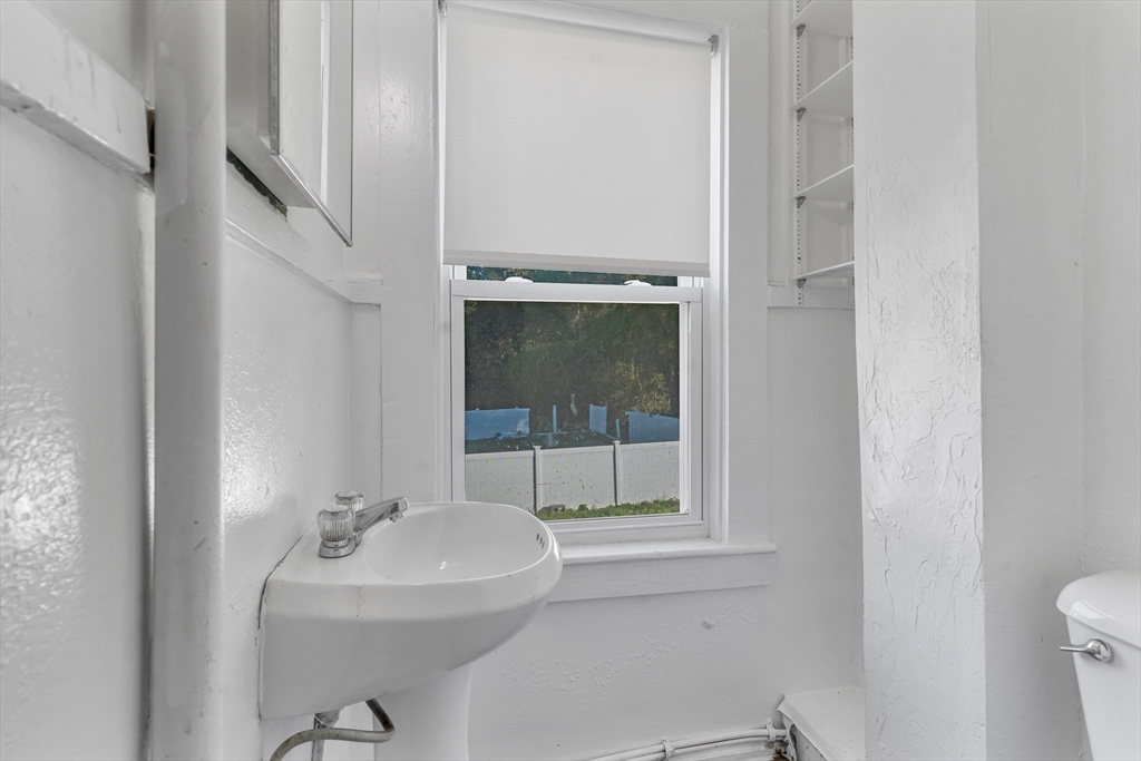 13 R Plain Street, Unit 2 Taunton, MA 02780 - Photo 10 of 21 a bathroom with a sink a toilet and shower