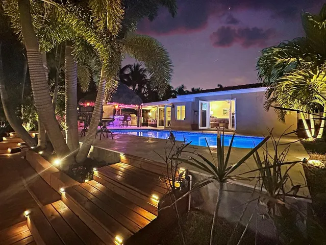 a kitchen with a table and chairs