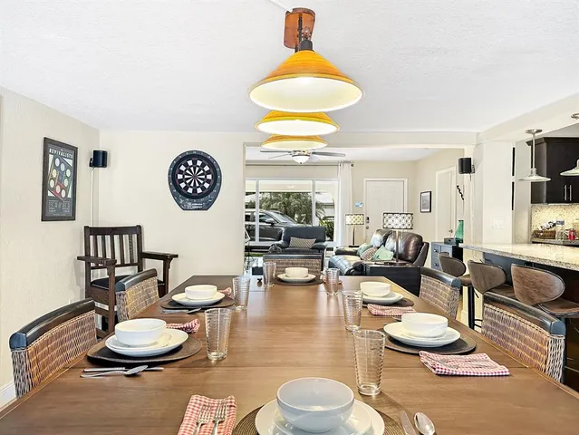 a kitchen with stainless steel appliances granite countertop a stove a sink dishwasher and a microwave oven on the granite countertops