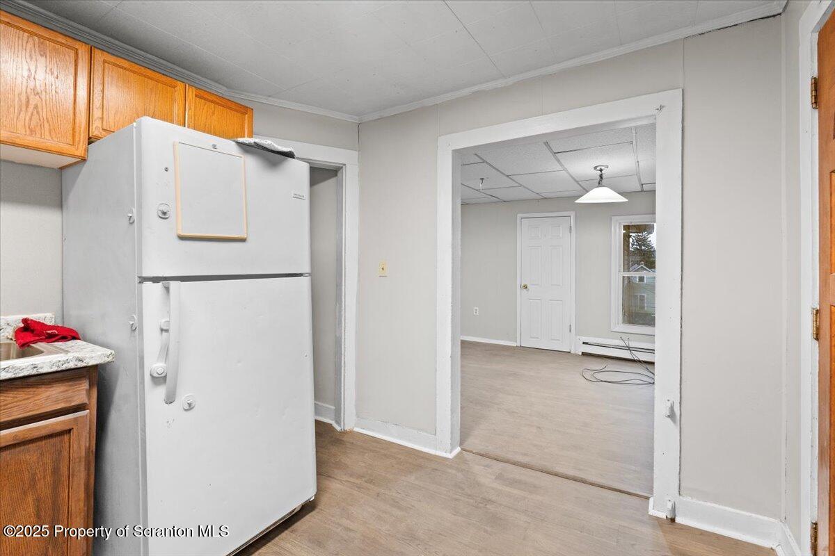 2515 North Main Avenue Scranton, PA 18508 - Photo 25 of 69 a view of kitchen with a refrigerator cabinets and a ceiling fan