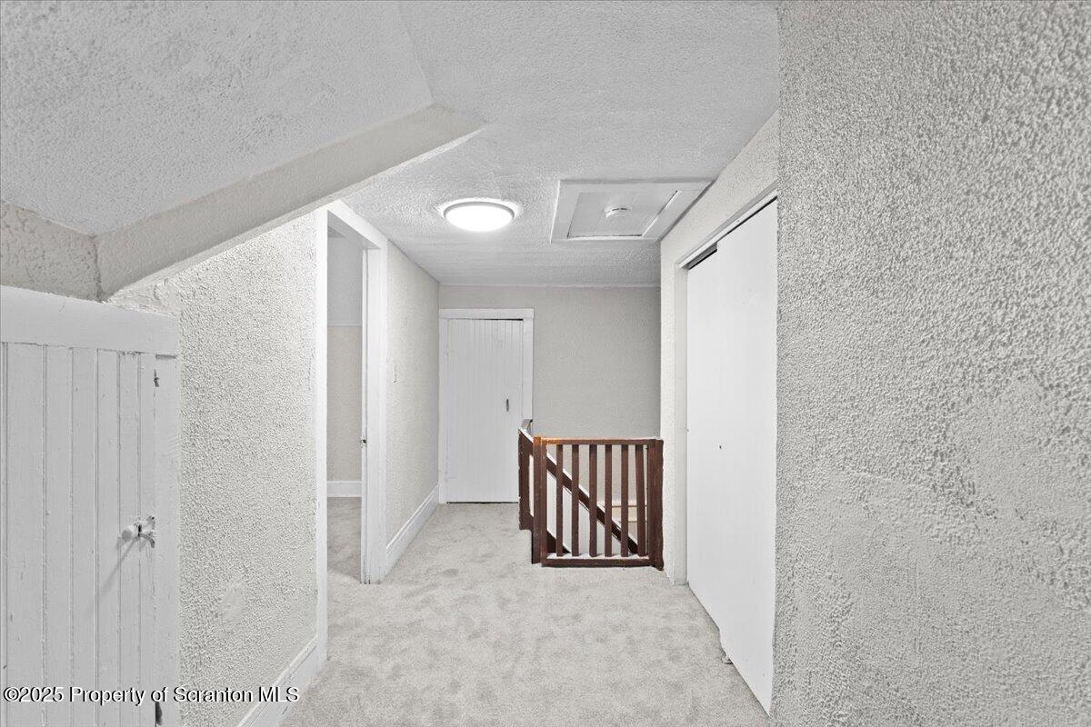 2515 North Main Avenue Scranton, PA 18508 - Photo 29 of 69 a view of a hallway with staircase