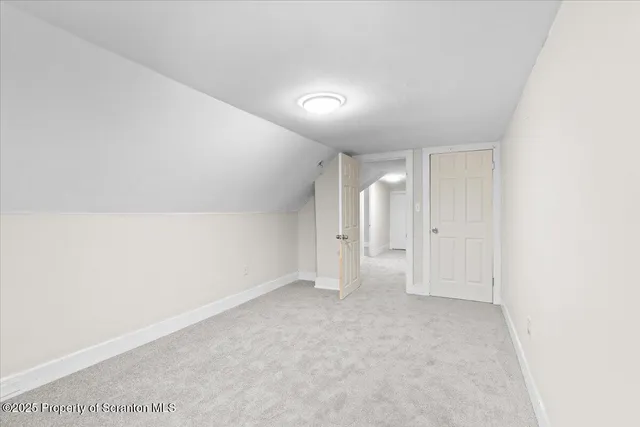 a bedroom with a bed and a closet