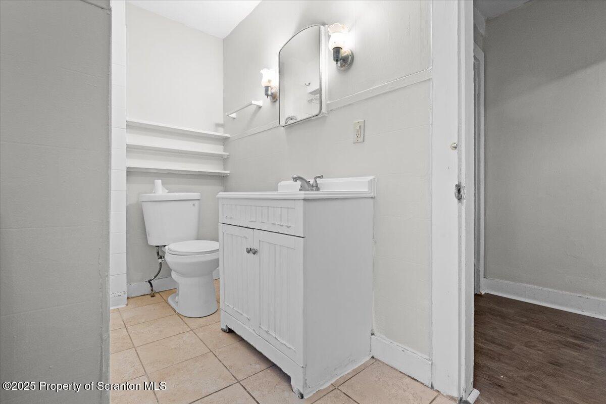 2515 North Main Avenue Scranton, PA 18508 - Photo 34 of 69 a bathroom with a sink a toilet and a mirror