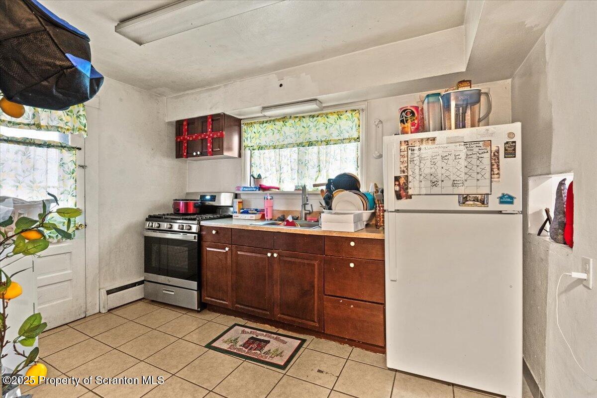 2515 North Main Avenue Scranton, PA 18508 - Photo 50 of 69 a kitchen with stainless steel appliances a stove a refrigerator and a counter