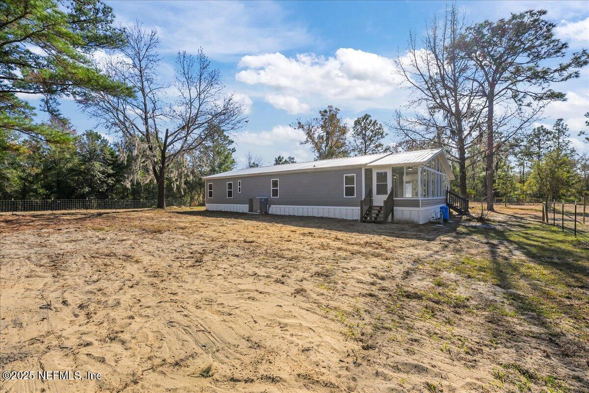 314 Union Avenue Interlachen, FL 32148 - Photo 12 of 30 a front view of a house with a yard