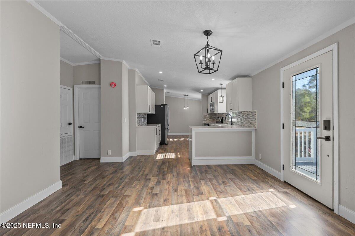 314 Union Avenue Interlachen, FL 32148 - Photo 14 of 30 a view of a kitchen with a sink and refrigerator