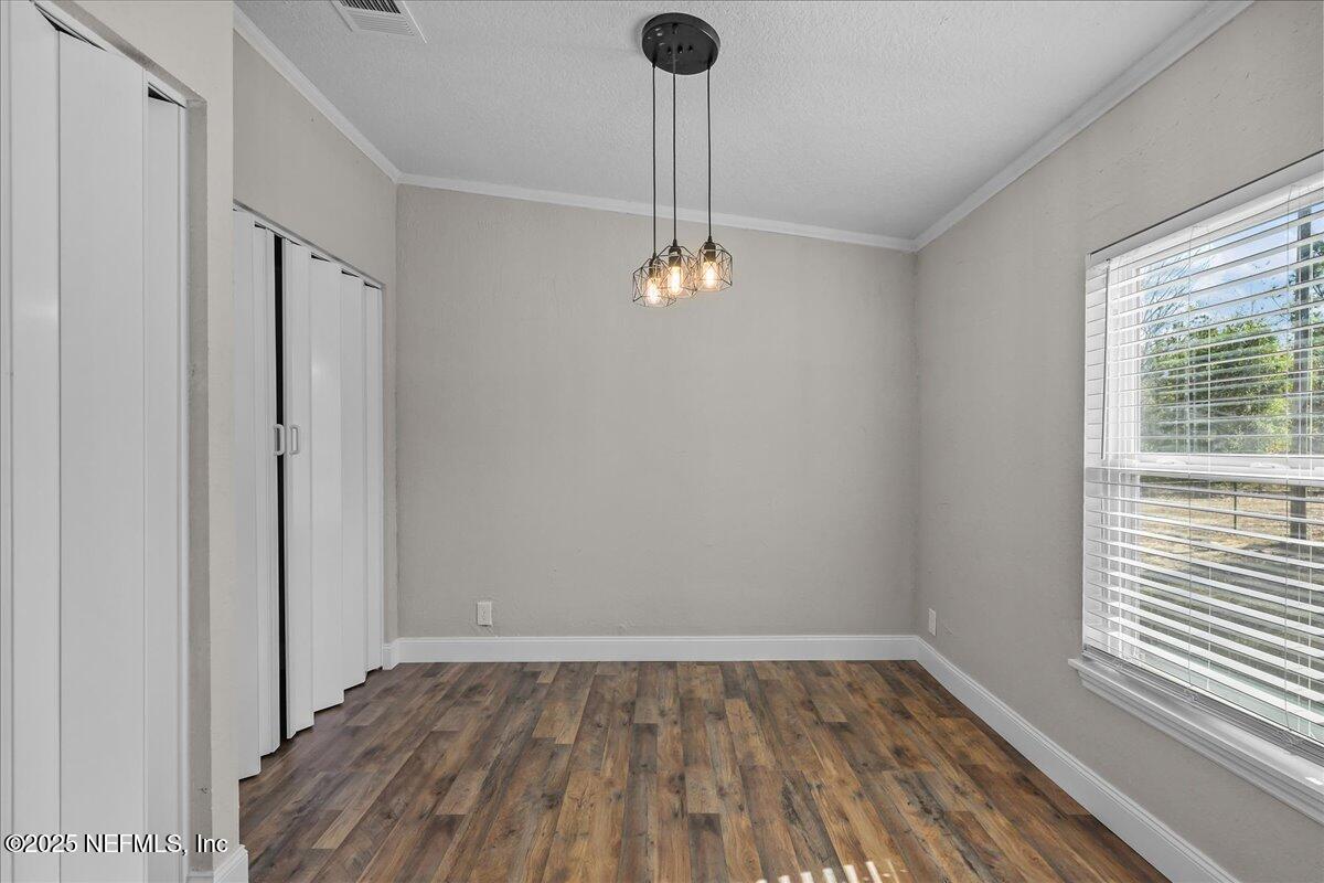 314 Union Avenue Interlachen, FL 32148 - Photo 21 of 30 a very nice looking room with wooden floor and a window