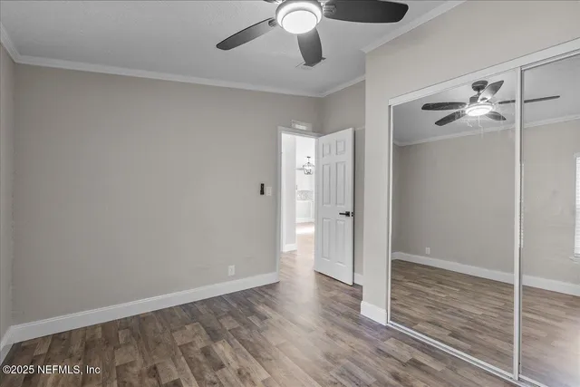 a view of an empty room and wooden floor