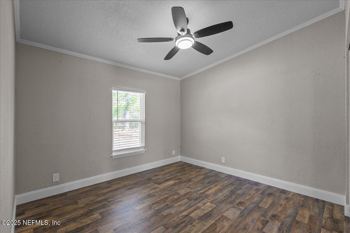 314 Union Avenue Interlachen, FL 32148 - Photo 28 of 30 wooden floor in an empty room with a window