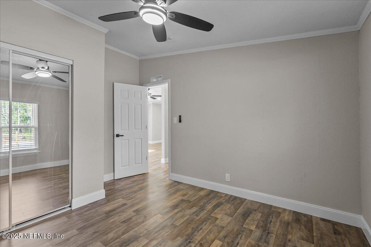 314 Union Avenue Interlachen, FL 32148 - Photo 29 of 30 wooden floor in an empty room with a window