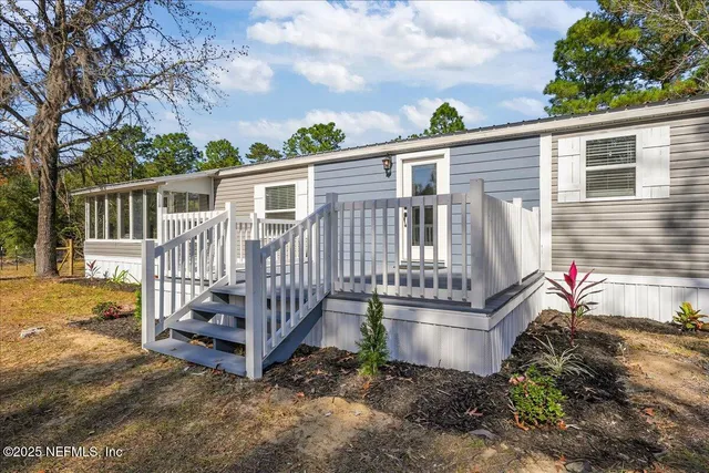 a view of a deck with wooden fence and floor