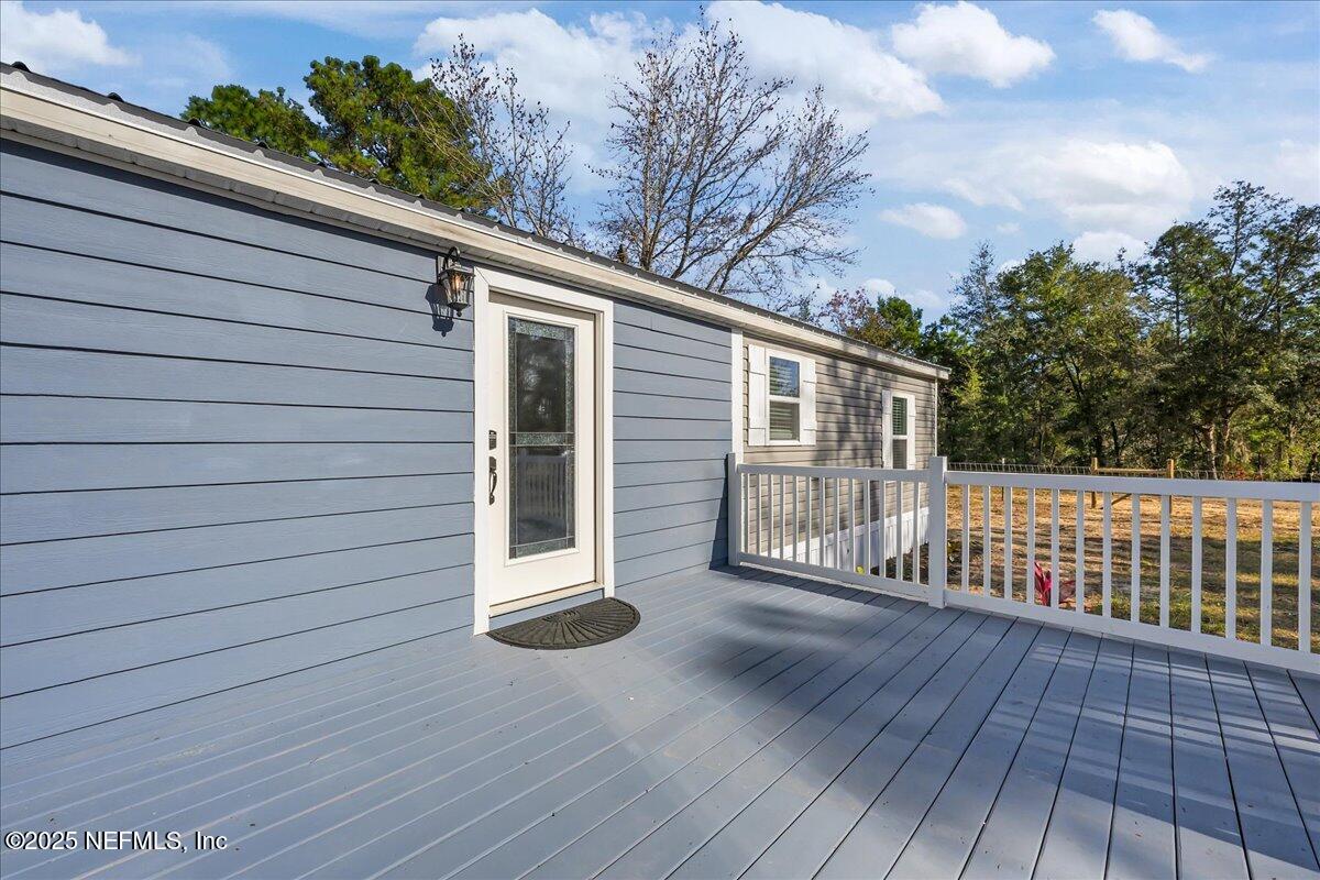314 Union Avenue Interlachen, FL 32148 - Photo 5 of 30 a view of backyard with a deck and wooden floor