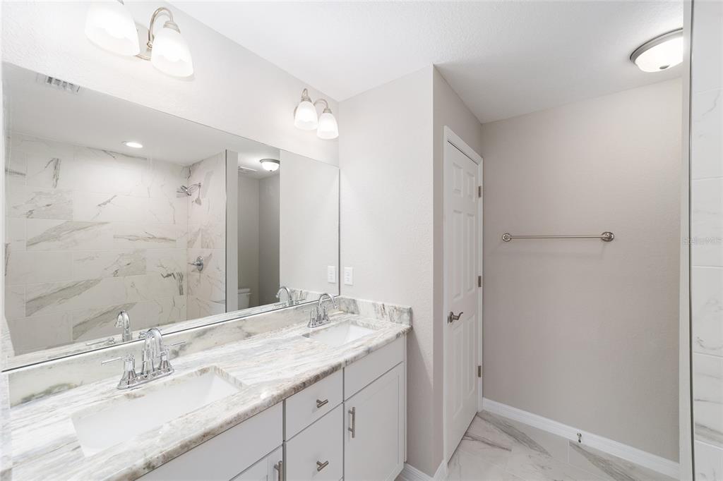 401 West Homeway Loop Citrus Springs, FL 34434 - Photo 19 of 23 a bathroom with a double vanity sink mirror and double