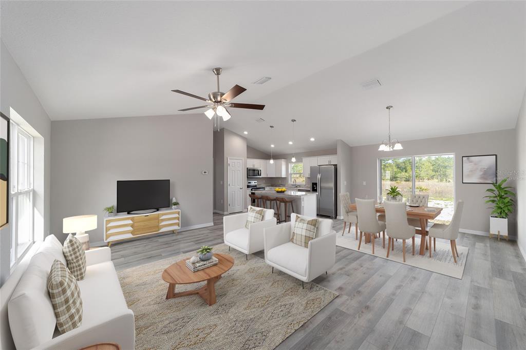 401 West Homeway Loop Citrus Springs, FL 34434 - Photo 6 of 23 a living room with furniture and a flat screen tv